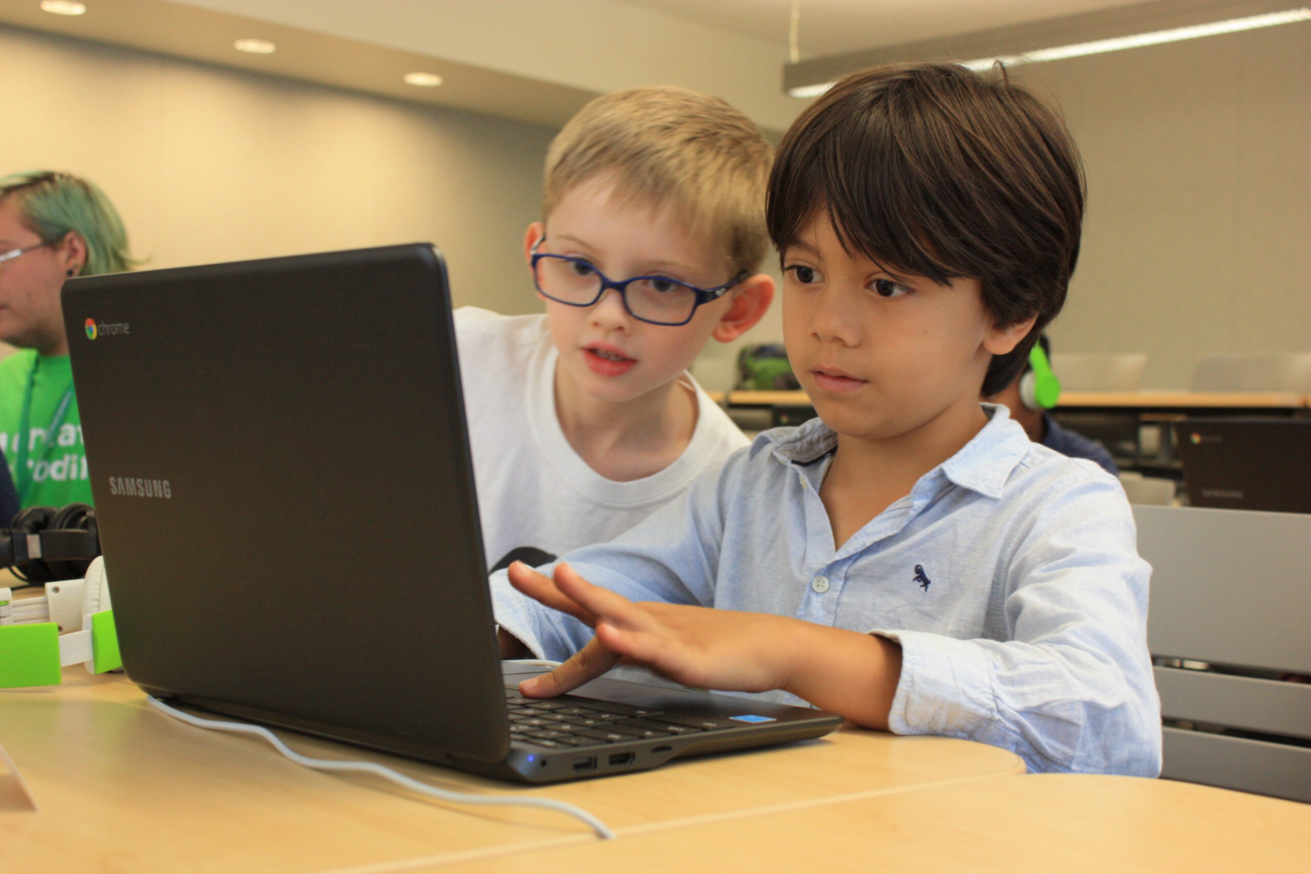 kids in our after-school programs engaged in coding and sharing their own game